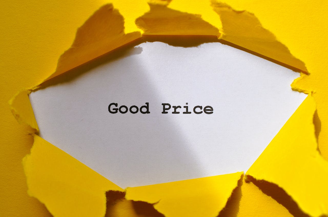 journey-02 Yellow paper torn to reveal Good Price. Perfect for sales and marketing concepts.